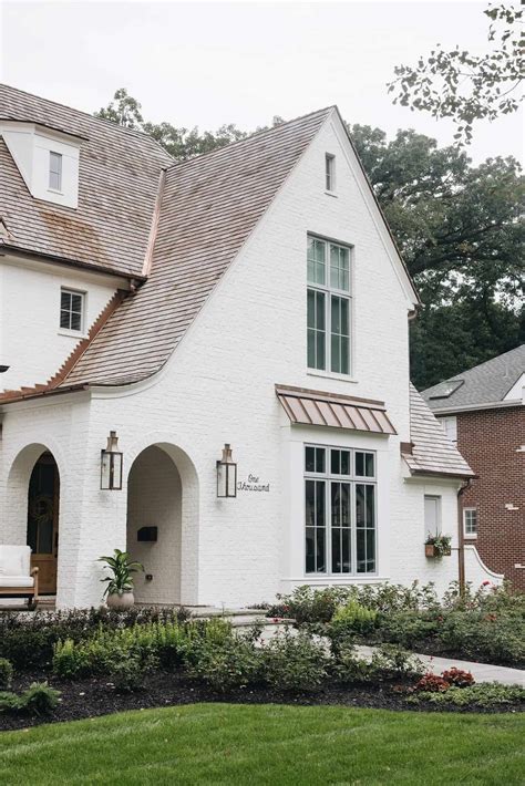 brick house white metal balcony|white brick exterior designs.